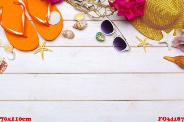 beachwear and accessories on a white wooden background