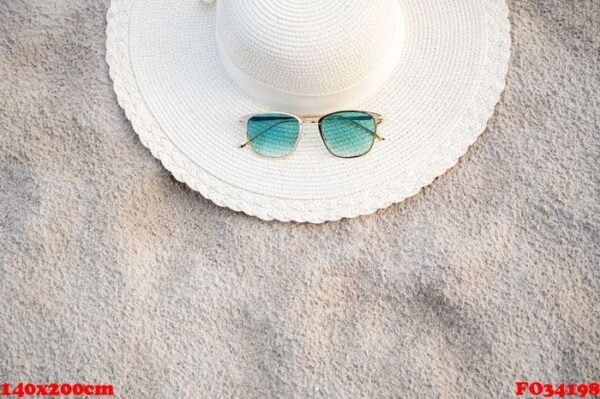 hats and glasses are located on the sea blue sea beaches on a clear day