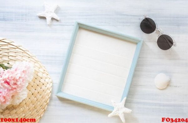 top view of summer blue picture frame with sunglasses and seashe