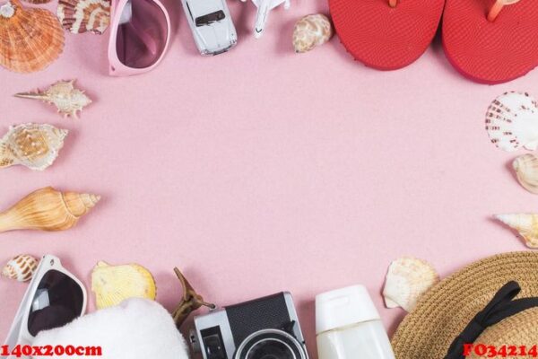 summer holiday background, travel concept with camera on pink ba