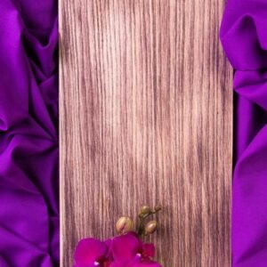 purple orchid on wooden background.