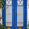 beautiful blue door with an ornament. vertical.