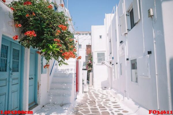 the narrow streets of the island with blue balconies, stairs and flowers.