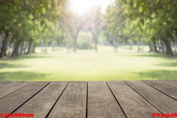 empty wooden table / floor in public park with green trees grass space for background, cover, poster, leaflet, flyer, advertising