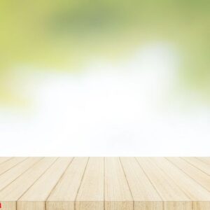 wood table top on with blur glass window wall background.