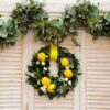 wreath made of laurel leaves, roses and lemons