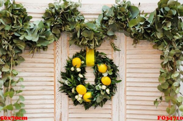 wreath made of laurel leaves, roses and lemons