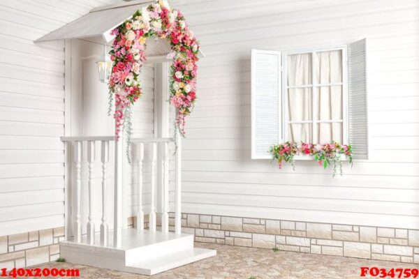 white house with flowers and white porch. provence.