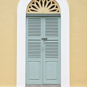 vintage green window and door on yellow wall