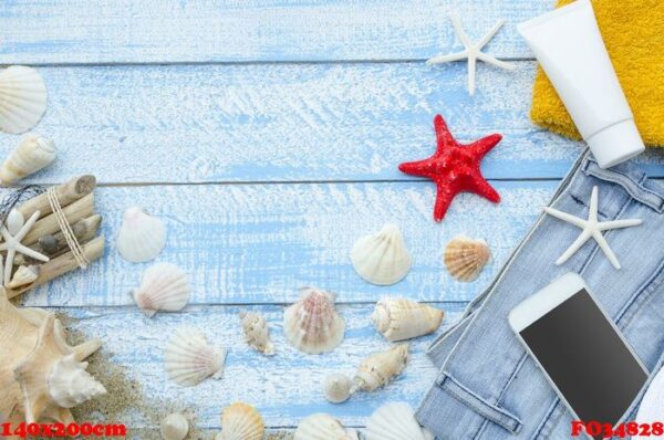 summer sea beach concept. top view blue wooden planks with seashells, rocks, sand and sunblock cream. white phone with blank screen and space for banner