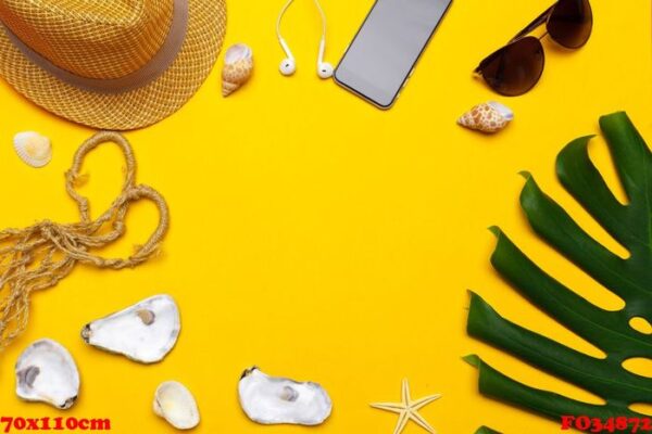 composition of beachwear and accessories on a yellow background