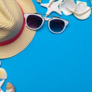 beachwear and accessories on a blue background