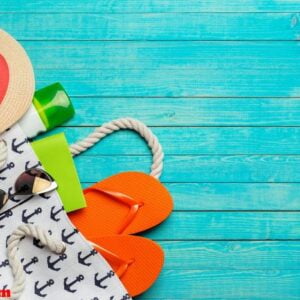 beach accessories on wooden table.