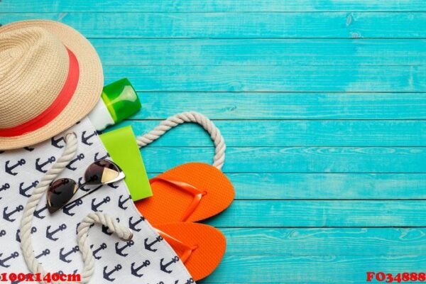 beach accessories on wooden table.