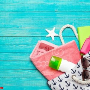 beach accessories on wooden table.