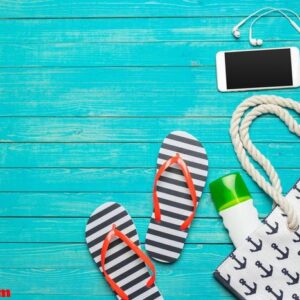 beach accessories on wooden table.