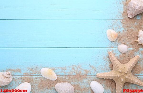 starfish and seashells with sand on a wooden background. summer concept