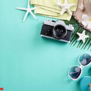 beach accessories retro film camera, sunglasses, flip flop starf