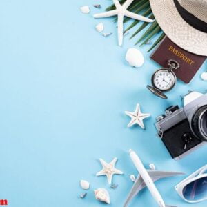 beach accessories retro film camera, sunglasses, passport book,