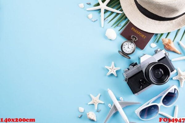 beach accessories retro film camera, sunglasses, passport book,