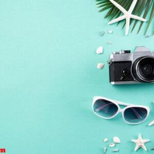 beach accessories retro film camera, sunglasses, flip flop starf