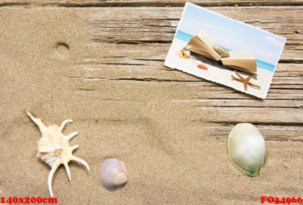 sand and book on planked wood. summer background with copy space