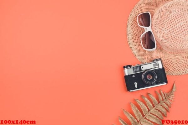 summer flat lay with copy space on coral background. old retro d