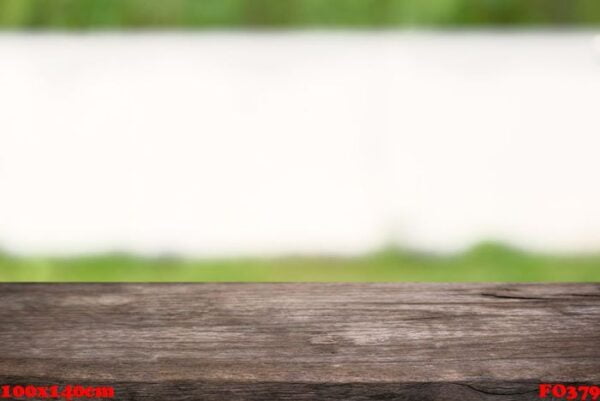 empty wooden table in front of abstract blurred background of co