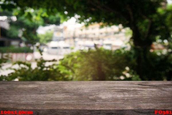 empty dark wooden table in front of abstract blurred background