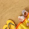 beach background with yellow towel