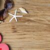 sand and shells on the wooden floor of the ,summer concept