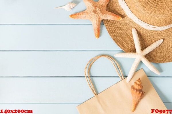 paper bag,hat and starfish on a blue background,top view,summer