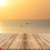 vintage wooden board empty table in front of sunset background.