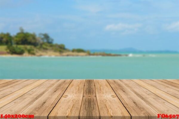 vintage wooden board empty table in front of blue sea & sky back