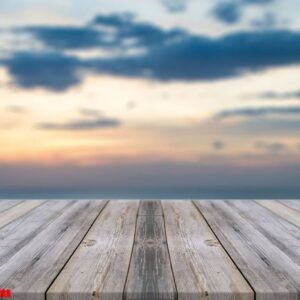 vintage wooden board empty table in front of sunset background.