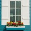 white window open and flower at house