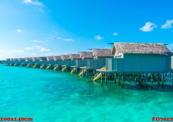 water villas over calm sea in tropical maldives island .