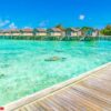 beautiful water villas in tropical maldives island .