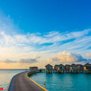 beautiful sunrise with water villas in tropical maldives islan