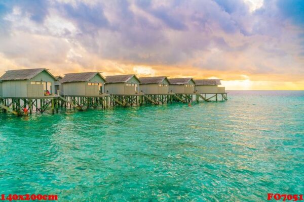 beautiful water villas in tropical maldives island at the sunset