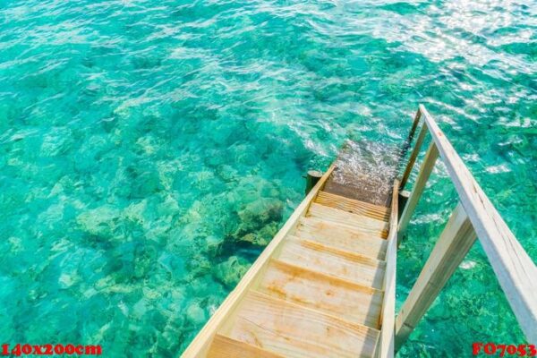 wood stair into the sea of tropical maldives island .