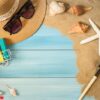 sand and shells on the wooden floor of the blue,summer concept