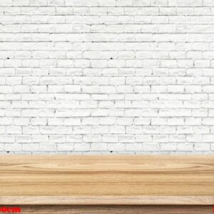 empty wood table and white brick wall in background. product dis