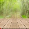 empty wood table top on nature green blurred background,space fo