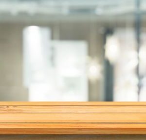 wooden board empty table blurred background. perspective brown w