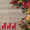 christmas wooden background with branches tree decorations sweet