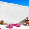 white wooden board with other objects by the beach