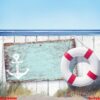 empty sign board and wooden fence on beach