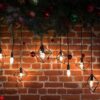 brick wall with light bulbs and new year's decoration