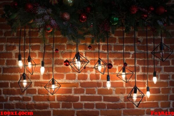 brick wall with light bulbs and new year's decoration